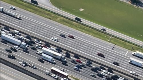 A hijacked Gwinnett County bus plows into police cruisers trying to stop it on the I-85/northbound ramp to Jimmy Carter Boulevard on June 12th, 2024. Credit: Doug Turnbull, WSB Skycopter