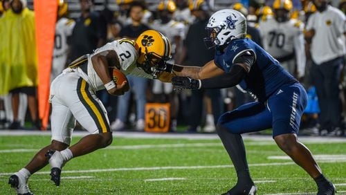 Valdosta’s Todd Robinson is taken down by his facemask during the game against South Gwinnett on September 13, 2024. Valdosta won 27-14. (Jamie Spaar for the Atlanta Journal Constitution)