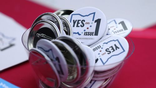 FILE - Buttons in support of Issue 1, the Right to Reproductive Freedom amendment, sit on display at a rally held by Ohioans United for Reproductive Rights at the Ohio Statehouse in Columbus, Ohio, Oct. 8, 2023. (AP Photo/Joe Maiorana, File)