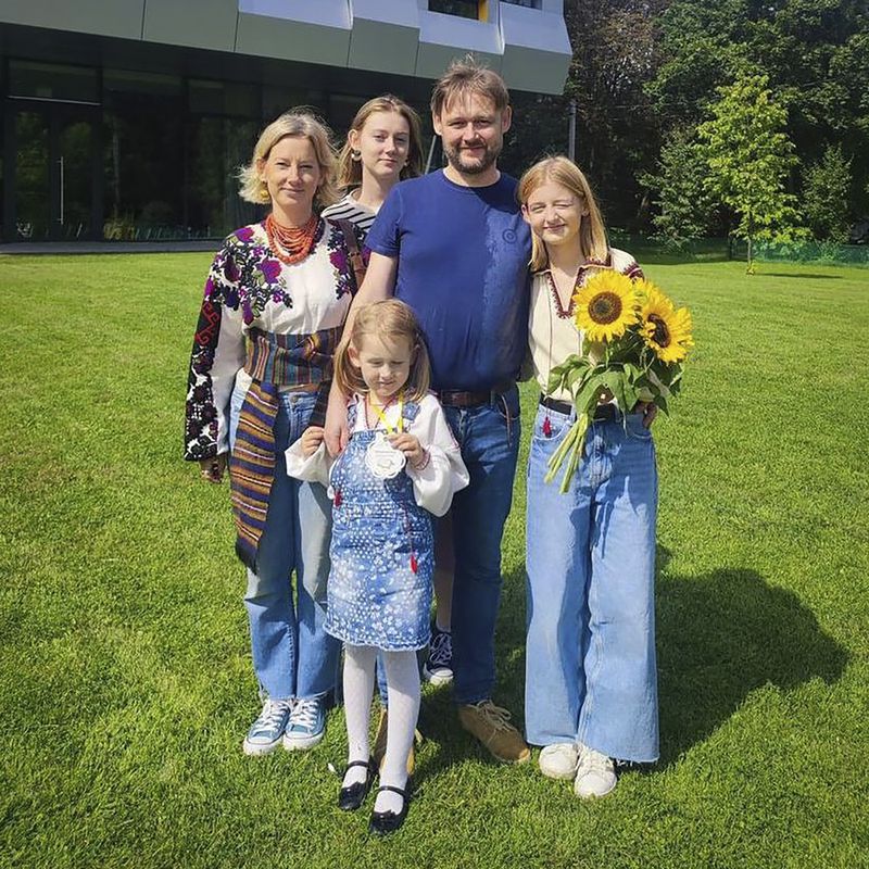 In this undated photo provided by the Lviv City Hall Press Office, Yaroslav Bazylevych poses for a photo with his family - wife Yevgenia, and their three daughters - Darina, 18, Emilia, 7, and Yaryna, 21, in Ukraine. Bazylevych lost his family in a Russian missile attack in the western city of Lviv, Ukraine, on Wednesday, Sept. 4, 2024. (Lviv City Hall Press Office via AP)