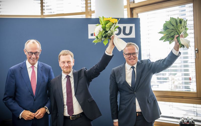 From left: Friedrich Merz, CDU federal chairman and CDU/CSU parliamentary group leader in the Bundestag, Michael Kretschmer (CDU), Minister President of Saxony and Mario Voigt, CDU state chairman in Thuringia, pose for a picture during a meeting after the state elections in Saxony and Thuringia, in Berlin, Monday, Sept. 2, 2024. (Michael Kappeler/dpa via AP)