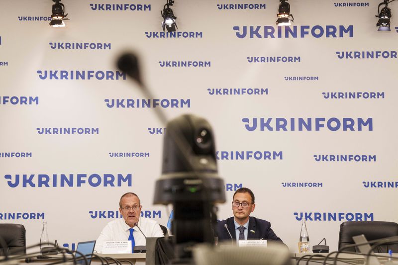 Doctor Hans Henri P. Kluge, WHO Regional Director for Europe, left, and Doctor Jarno Habicht, WHO Representative in Ukraine speak to the media during a press conference in Kyiv, Ukraine, Thursday Sept. 12, 2024. (AP Photo/Evgeniy Maloletka)