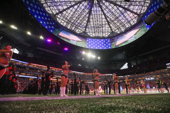 Georgia Bulldogs spirit team members perform during the SEC Championship football game against the Alabama Crimson Tide at the Mercedes-Benz Stadium in Atlanta, on Saturday, December 2, 2023. (Jason Getz / Jason.Getz@ajc.com)