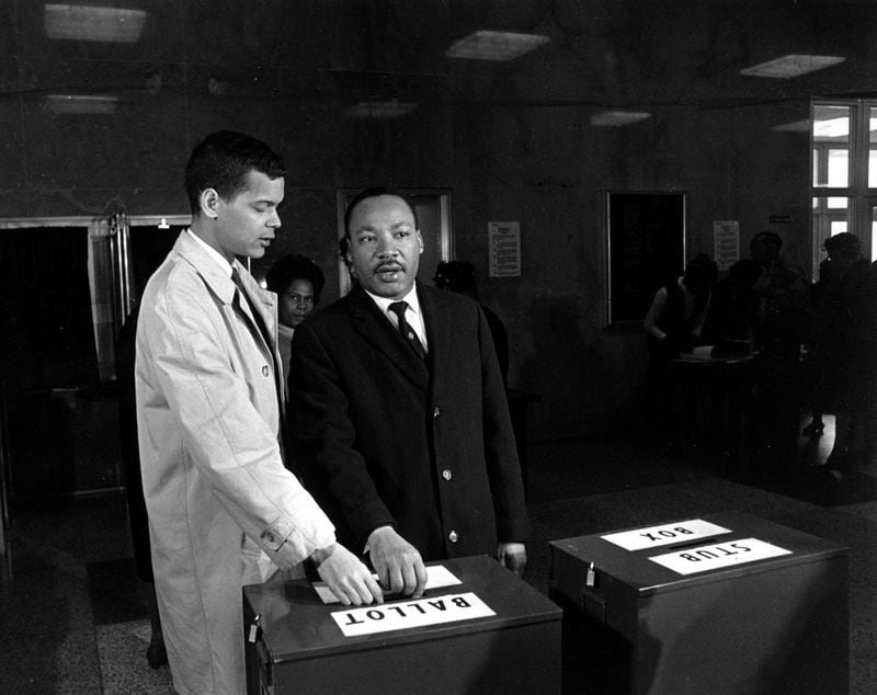 This is a photo of Julian Bond and Dr. Martin Luther King Jr. casting their ballots in 1966. (AP Photo)