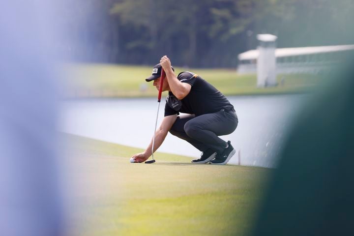 Viktor Hovland works on the practice green before the final round of the Tour Championship at East Lake Golf Club, Sunday, Sept. 1, 2024, in Atlanta.
(Miguel Martinez / AJC)