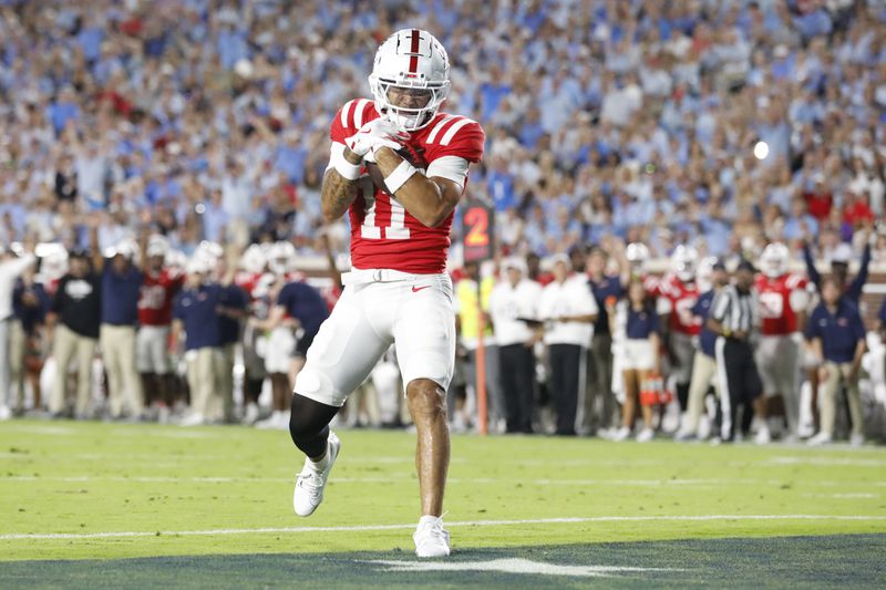 Mississippi wide receiver Jordan Watkins (11) makes a touchdown during the first half of an NCAA college football game against Georgia Southern, Saturday, Sept. 21, 2024, in Oxford, Miss. (AP Photo/Sarah Warnock)