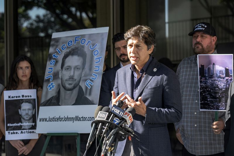 Los Angeles Councilmember Kevin de Leon, at the podium, surrounded by friends of late actor Johnny Wactor, speaks at a news conference outside the Clara Shortridge Foltz Criminal Justice Center in Los Angeles, Monday, Aug. 19, 2024. Los Angeles police arrested four people on Thursday in the fatal shooting of former “General Hospital” actor Wactor. (AP Photo/Damian Dovarganes)