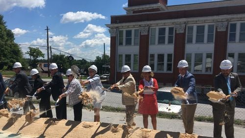 Lawrenceville officials and Aurora Theater leaders celebrated the groundbreaking of the Lawrenceville Performing Arts Center on Thursday. (Amanda C. Coyne/AJC)