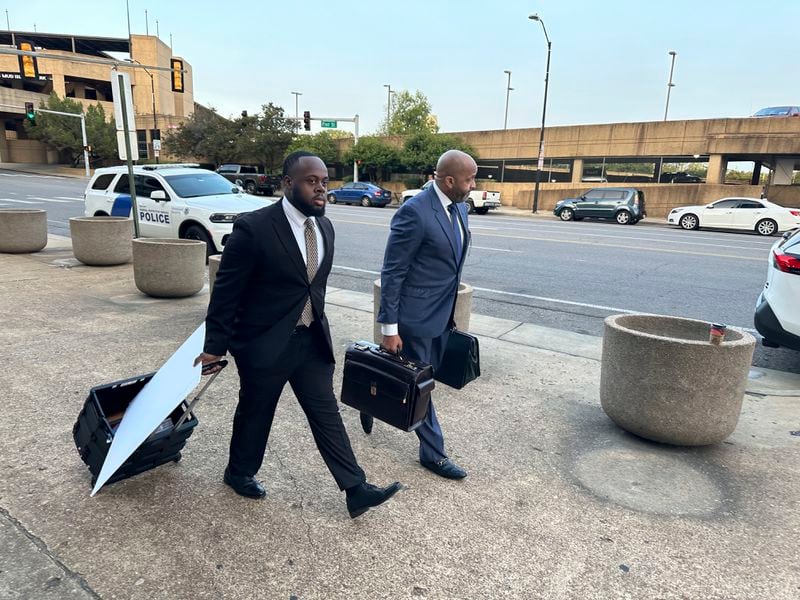 Former Memphis police officer Tadarrius Bean, left, and his lawyer John Keith Perry walk towards the entrance of a federal courthouse before the start of jury selection of the trial in the Tyre Nichols case on Monday, Sept. 9, 2024, in Memphis, Tenn. (AP Photo/Adrian Sainz)