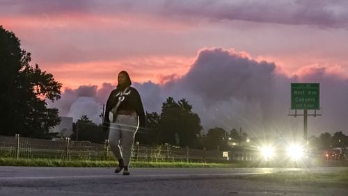 A large plume caused by a chemical reaction was visible Tuesday over the BioLab facility in Conyers, where a fire broke out Sunday. (John Spink/The Atlanta Journal-Constitution)