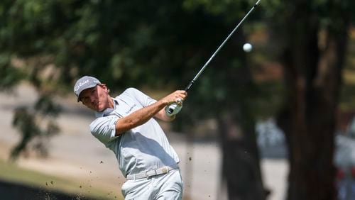 Russell Henley hits his second shot on the first fairway during the first round of the Tour Championship at East Lake Golf Club, on Thursday, Aug. 29, 2024, in Atlanta. (Jason Getz / AJC)
