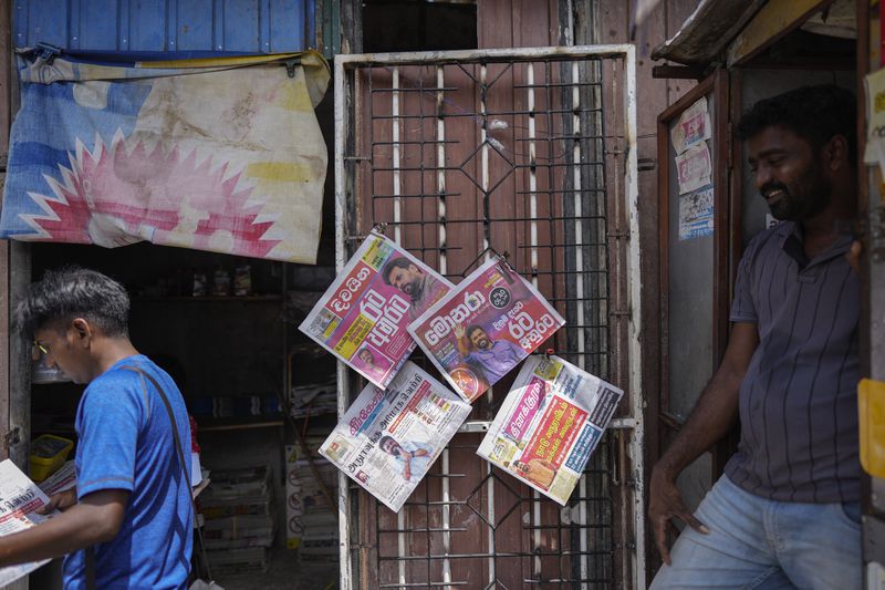 Newspapers with headlines about Sri Lanka's new president elect Marxist lawmaker Anura Kumara Dissanayake are on display in Colombo, Sri Lanka, Monday, Sept. 23, 2024. (AP Photo/Eranga Jayawardena)