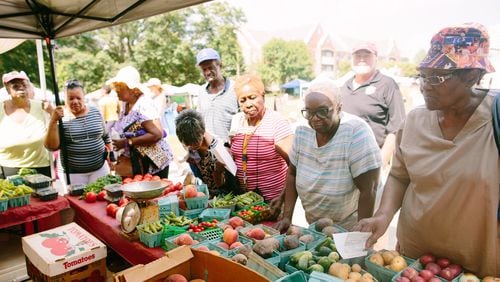 Healthy eating is a little more affordable through Georgia Fresh for Less, a program of the nonprofit Wholesome Wave Georgia. Those on a limited income can purchase twice as much fresh produce because Wholesome Wave Georgia will match what they spend, dollar for dollar, at participating farmers markets like the one pictured here. CONTRIBUTED BY: Wholesome Wave Georgia.