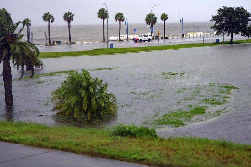 Orleans Levee District Police patrol Lakeshore Drive along Lake Ponchartrain as wind and rain pick up from Hurricane Francine in New Orleans, Wednesday, Sept. 11, 2024. (AP Photo/Matthew Hinton)