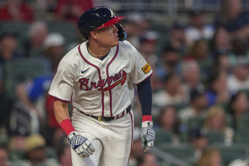 Atlanta Braves' Gio Urshela hits a single to left field in the fourth inning of a baseball game against the Philadelphia Phillies, Wednesday, Aug. 21, 2024, in Atlanta. (AP Photo/Jason Allen)