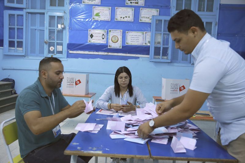 Election officials count votes after the presidential elections in the capital Tunis, Tunisia, Sunday, Oct. 6, 2024. (AP Photo/Anis Mili)