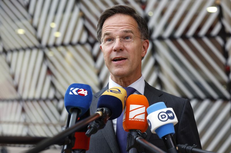 Netherland's Prime Minister Mark Rutte speaks with the media as he arrives for an EU summit in Brussels, Thursday, June 27, 2024. European Union leaders are expected on Thursday to discuss the next EU top jobs, as well as the situation in the Middle East and Ukraine, security and defence and EU competitiveness. (AP Photo/Geert Vanden Wijngaert)