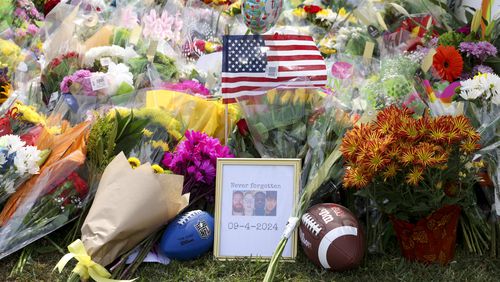 A memorial with images of the those killed are from left to right; Richard “Ricky” Aspinwall, Cristina Irimie, Mason Schermerhorn, and Christian Angulo at a memorial at Apalachee High School, Friday, Sept. 6, 2024, in Winder, Ga. A 14-year-old Apalachee student is accused of shooting and killing two fellow students and two teachers and injuring nine others at Apalachee High School on Wednesday. (Jason Getz / AJC)