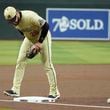 Arizona Diamondbacks third baseman Eugenio Suárez watches the ball bounce off third base for an infield single by San Francisco Giants' Heliot Ramos during the first inning of a baseball game Tuesday, Sept. 24, 2024, in Phoenix. (AP Photo/Ross D. Franklin)