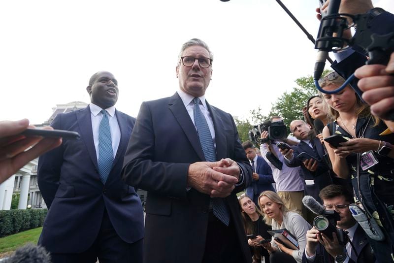 Britain's Prime Minister Keir Starmer and Foreign Secretary David Lammy, speak to the media outside the White House in Washington following a meeting with President Joe Biden, Friday, Sept. 13, 2024. (Stefan Rousseau/Pool Photo via AP)