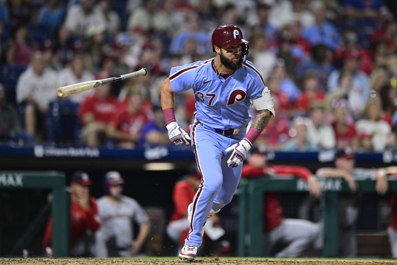 Philadelphia Phillies' Weston Wilson hits a double off Washington Nationals' Orlando Ribalta during the eighth inning of a baseball game, Thursday, Aug. 15, 2024, in Philadelphia. (AP Photo/Derik Hamilton)