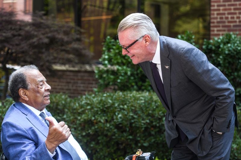 Andrew Young, former ambassador to the United Nations, (left), talks with Delta CEO Ed Bastian during the building dedication event at Delta headquarters in Atlanta, Georgia on  Monday, June 24, 2024.  (Ziyu Julian Zhu / AJC)