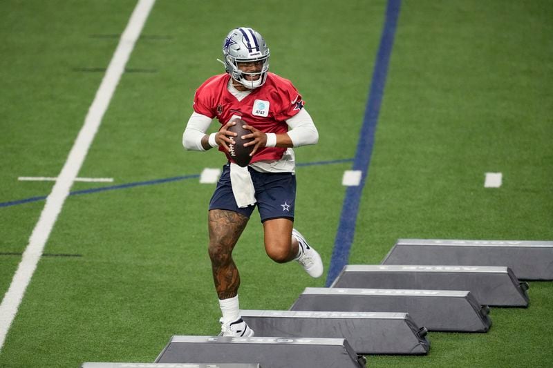 Dallas Cowboys quarterback Dak Prescott (4) runs drills during an NFL football practice at the team's training facility, Wednesday, Aug. 28, 2024, in Frisco, Texas. (AP Photo/Tony Gutierrez)