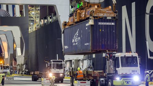 (file photo) Five ship-to-shore cranes and gangs of longshoremen work the container ship YM Witness at the Georgia Ports Authority's Port of Savannah, Sept. 29, 2021, in Savannah, Ga. (AP Photo/Stephen B. Morton, File)