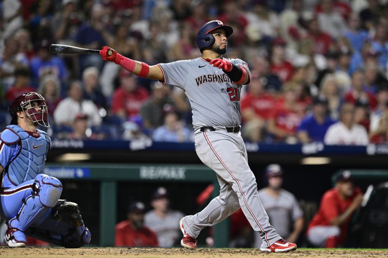 Washington Nationals' Keibert Ruiz, right, watch his solo home run off Philadelphia Phillies' Orion Kerkering during the seventh inning of a baseball game, Thursday, Aug. 15, 2024, in Philadelphia. (AP Photo/Derik Hamilton)