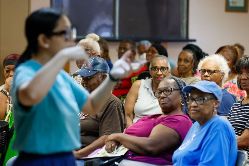 Attendees of a nutrition class listen to Cecilia Tran from the University of Georgia Extension during a nutrition Class at St Mark AME Church on Tuesday, June 18, 2024, in Atlanta. (Miguel Martinez / AJC)