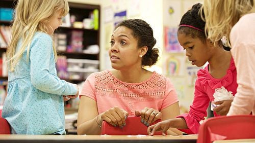 Midtown International School faculty member Kascha Adeleye works with students in her class where enrollment is capped at 12. The school caters to the needs of gifted students.
