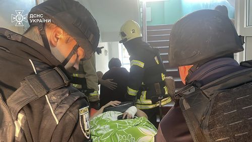 In this photo provided by the Ukrainian Emergency Service, emergency services workers evacuate patients after Russian attacks on a medical center in the northeastern Ukrainian city of Sumy Saturday, Sept. 28, 2024. (Ukrainian Emergency Service via AP)