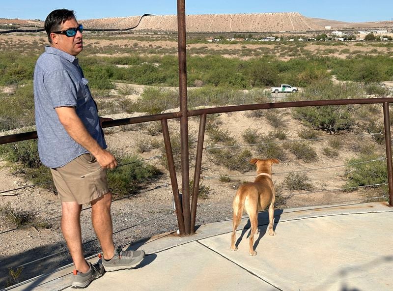 Robert Ardovino, a partner in a decades-old family restaurant business, surveys his property on the U.S. border with Mexico in Sunland Park, N.M., Thursday, Aug. 22, 2024. Ardovino has a close-up view of border enforcement efforts and bristles at politicians talking from afar about an "open border." The politics of immigration look different from communities on the Southwest border that are voting in hotly contested congressional races. (AP Photos/Morgan Lee)