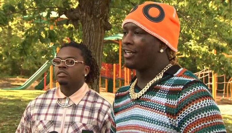 Gunna (left) speaks with reporters alongside Young Thug after posting bond for several Fulton County inmates. 