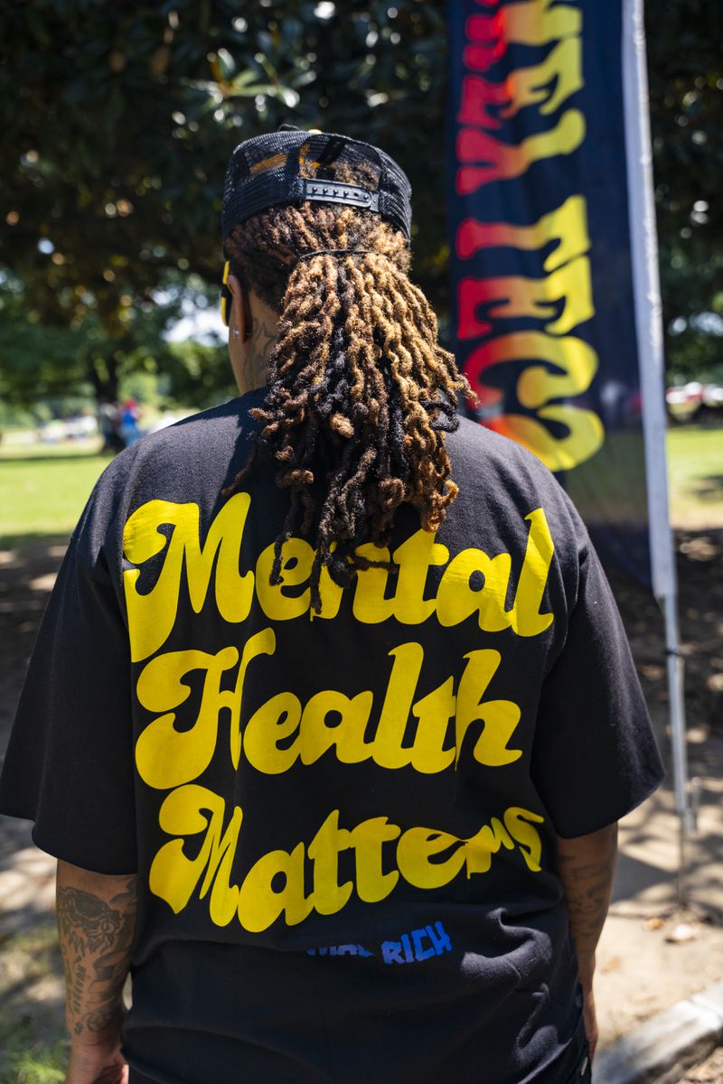 An atendee wears a shirt that says "Mental Health Matters" at the Pure Heat Community Festival in Piedmont Park on Sunday, Sept. 1, 2024.  (Olivia Bowdoin for the AJC).