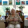 Lillian Mortimer never expected to live anything close to what she has. The 107-year-old, who lives in an assisted living facility in Cobb County, thrives staying busy, including taking painting classes for the first time in her life. (Robyn Hutson/AJC)