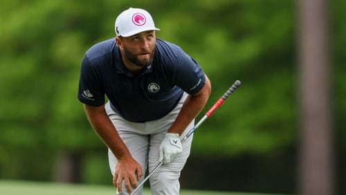 Jon Rahm, the 2023 Masters Champion, reacts to his second shot on the 11th fairway during the practice round of the 2024 Masters Tournament at Augusta National Golf Club, Tuesday, April 9, 2024, in Augusta, Ga. (Jason Getz / jason.getz@ajc.com)