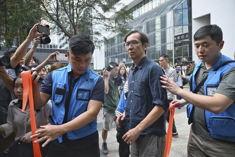 Chung Pui-kuen, the former chief editor of Hong Kong's now-shuttered outlet Stand News, walks outside on bail after he was found guilty in a landmark sedition trial under a colonial-era law, in Wanchai District Court in Hong Kong on Thursday, Aug. 29, 2024. (AP Photo/Billy H.C. Kwok)