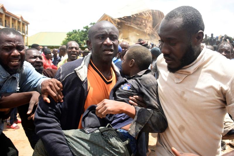 A student is rescued from the rubble of a collapsed two-storey building in Jos, Nigeria, Friday, July, 12, 2024. At least 12 students have been killed after a school building collapsed and trapped them in northern Nigeria, authorities said on Friday. (AP Photos)