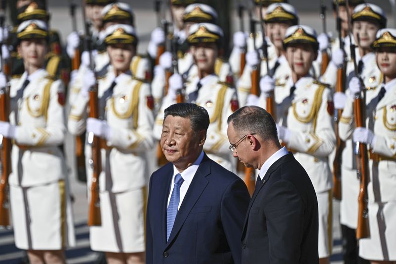 Chinese President Xi Jinping, left and Poland's President Andrzej Duda review the honour guard during the welcome ceremony at the Great Hall of the People in Beijing, Monday, June 24, 2024.(Pedro Pardo/Pool Photo via AP)