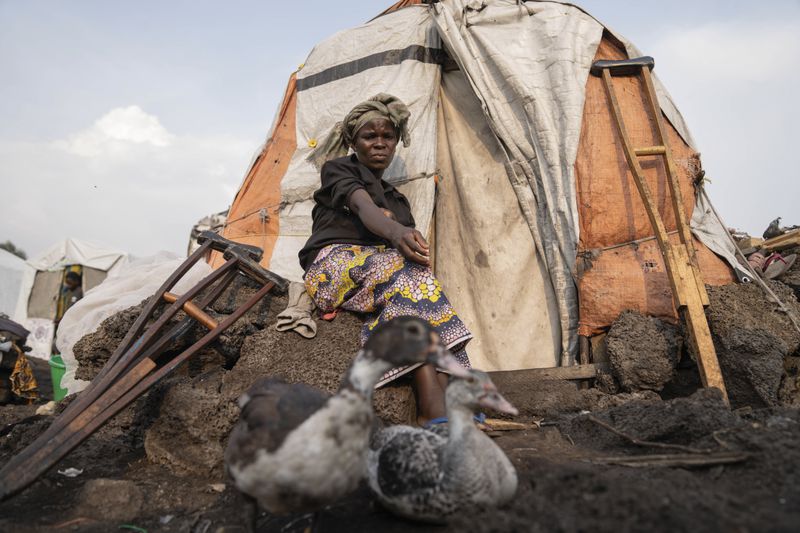 Sarah Bagheni, in the Bulengo refugee camp in Goma, Congo, suspects she may be infected with Mpox after the World Health Organization had declared Thursday, Aug, 15, 2024, the increasing spread of mpox in Africa a global health emergency, warning the virus might ultimately spill across international borders. (AP Photo/Moses Sawasawa)