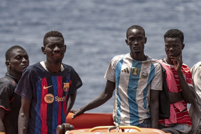 Migrants disembark at the port of "La Estaca" in Valverde at the Canary island of El Hierro, Spain, Monday, Aug. 26, 2024. Migrants arrived by boat after a thirteen-day voyage from the coast of Senegal. (AP Photo/Maria Ximena)