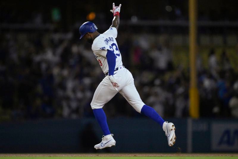 Los Angeles Dodgers Jason Heyward (23) rounds the bases after hitting a pinch hit three-run home run in the eighth inning of a baseball game against the Seattle Mariners, Tuesday, Aug. 20, 2024, in Los Angeles. (AP Photo/Jayne-Kamin-Oncea)