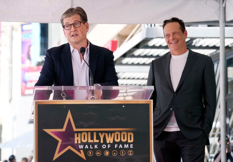 Actor Vince Vaughn, right, reacts as guest speaker Bill Lawrence, creator of the new Apple TV+ series "Bad Monkey," makes remarks during a ceremony to award Vaughn a star on the Hollywood Walk of Fame, Monday, Aug. 12, 2024, in Los Angeles. (AP Photo/Chris Pizzello)