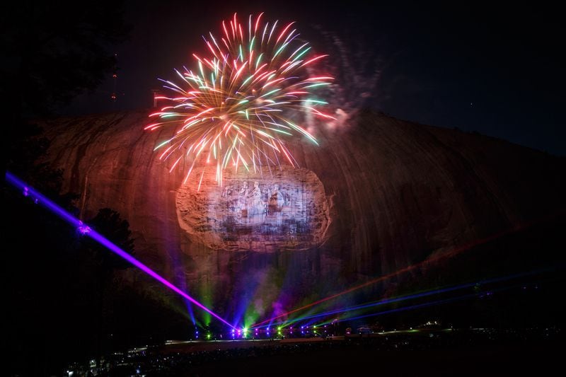 Fireworks explode during the laser show at Stone Mountain Park last April. Fireworks and the popular laser show will also be held for visitors during the Fourth of July celebration, which has been extended. STEVE SCHAEFER / SPECIAL TO THE AJC