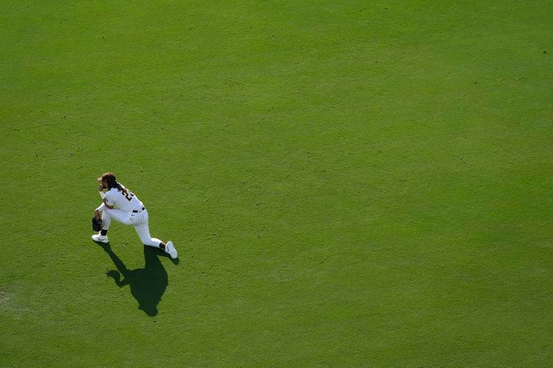 San Diego Padres right fielder Fernando Tatis Jr. looks on during a mound visit in the fifth inning of a baseball game against the Detroit Tigers, Monday, Sept. 2, 2024, in San Diego. (AP Photo/Gregory Bull)