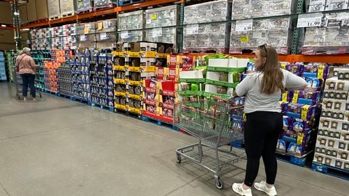 Shoppers consider purchases in a Costco warehouse Thursday, Sept. 12, 2024, in Thornton, Colo. (AP Photo/David Zalubowski)