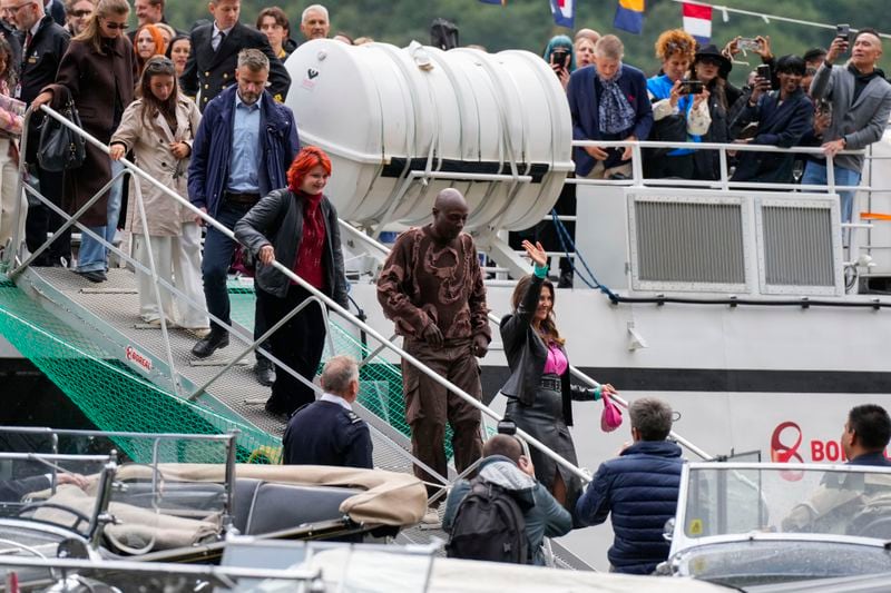 Norway's Princess Martha Louise, front, and Durek Verret, second, and guests arrive from Alesund to Geiranger, Norway, Friday Aug. 30, 2024, ahead of their wedding celebration on Saturday. (Cornelius Poppe/NTB via AP)