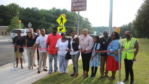 A ribbon cutting ceremony was held Wednesday for the Edna Umeh memorial crosswalk in front of Lindley High School. Umeh, 64, was fatally hit by a car on Nov. 30, 2017, while she was directing traffic on Veterans Memorial Highway in Mableton.