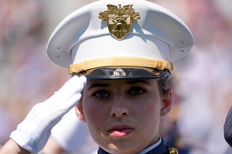 A graduating cadet stands during the playing of the national anthem at the U.S. Military Academy commencement ceremony, Saturday, May 25, 2024, in West Point, N.Y. (AP Photo/Alex Brandon)